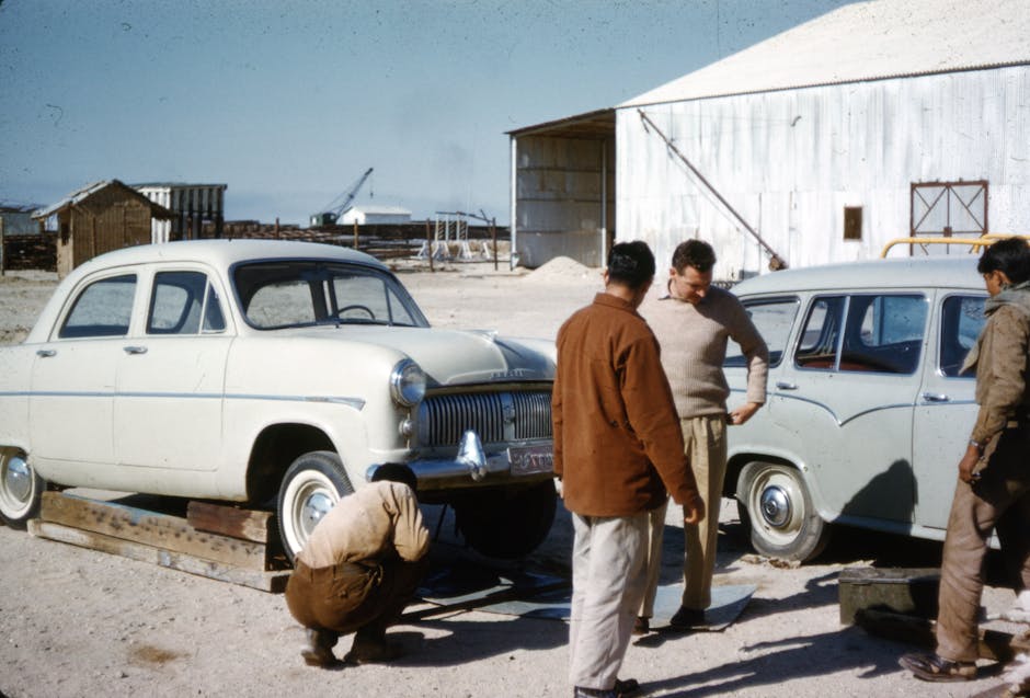 Men Standing Beside Vintage Cars