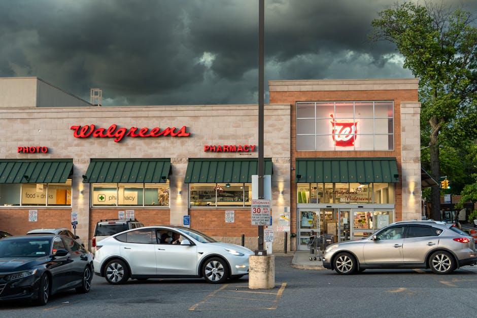 A pharmacy store with cars parked in front